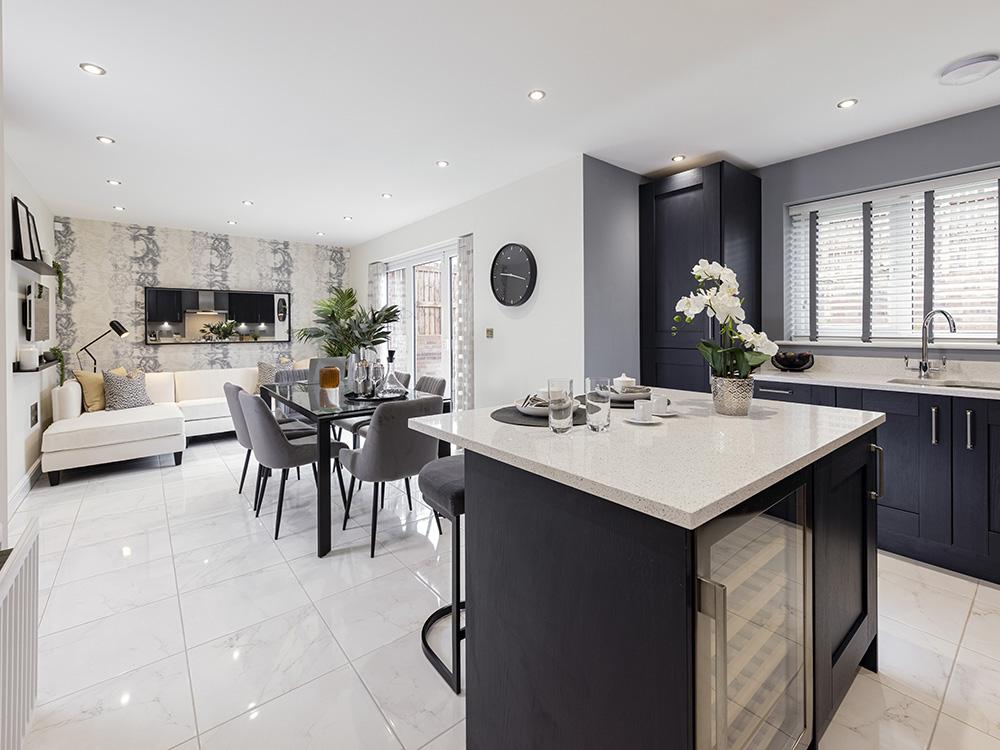 Open plan kitchen/dining/family area with French...