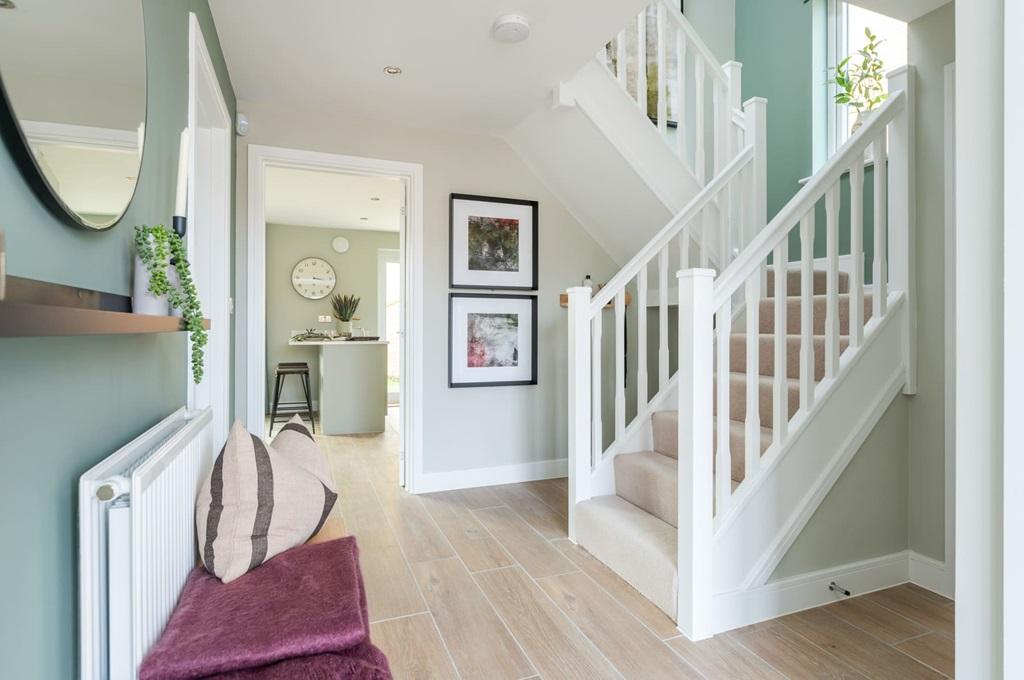 A welcoming entrance hall with feature staircase