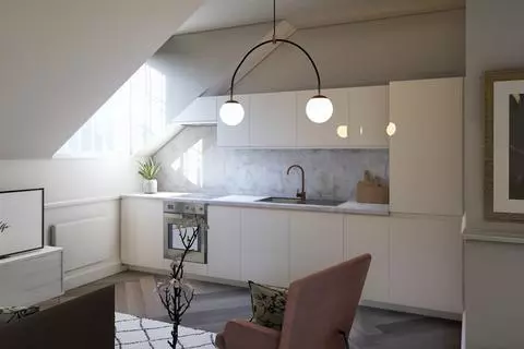 Grey kitchen cabinets against sage green walls in an attic apartment - COCO  LAPINE DESIGNCOCO LAPINE DESIGN