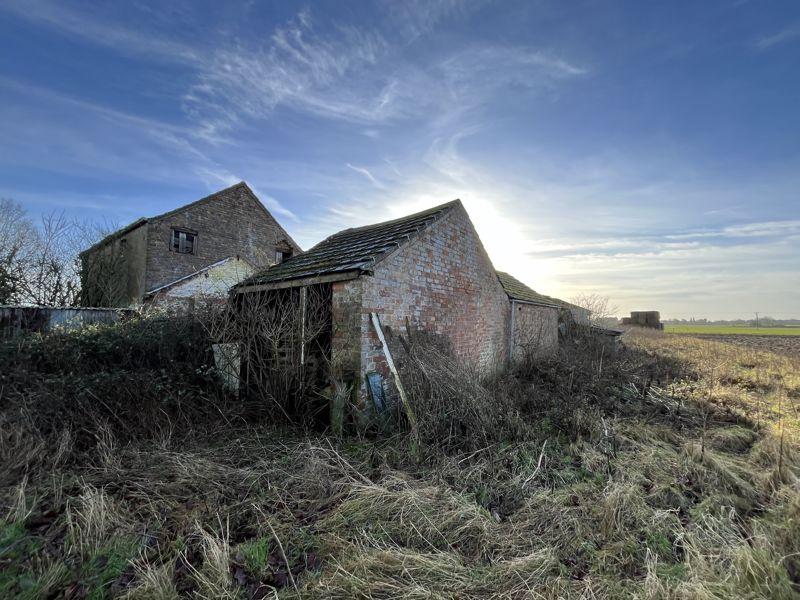 Corner outbuilding