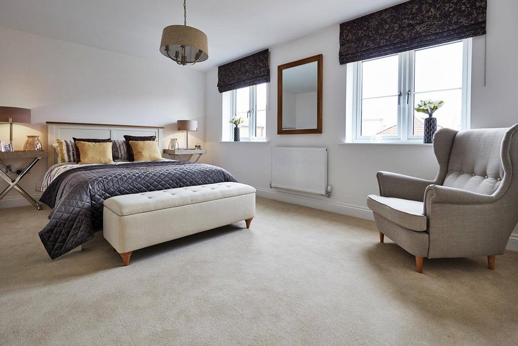 A spacious main bedroom also features an en-suite