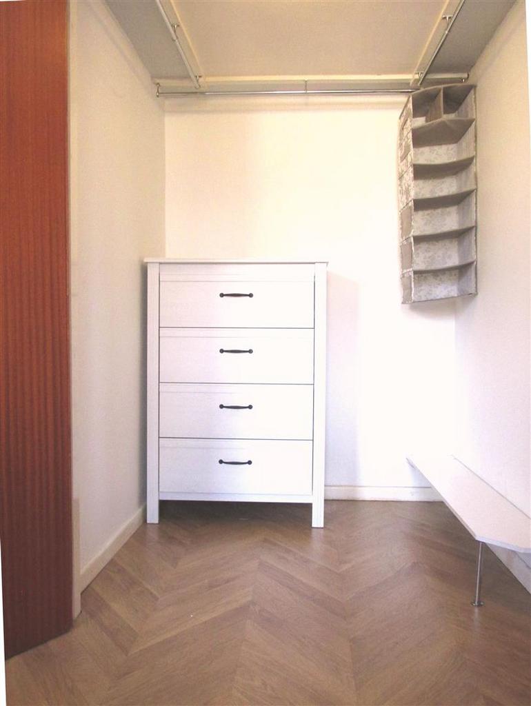 Huge walk in wardrobe in bedroom.jpeg