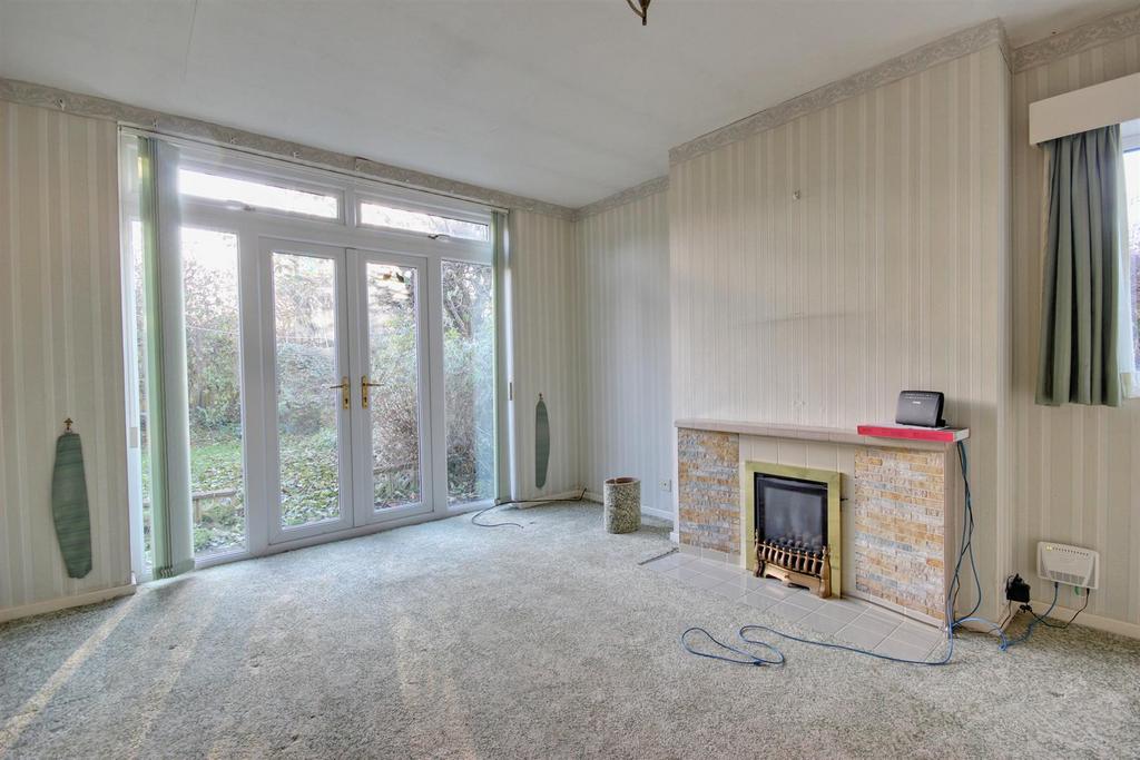 Lounge with french doors to garden
