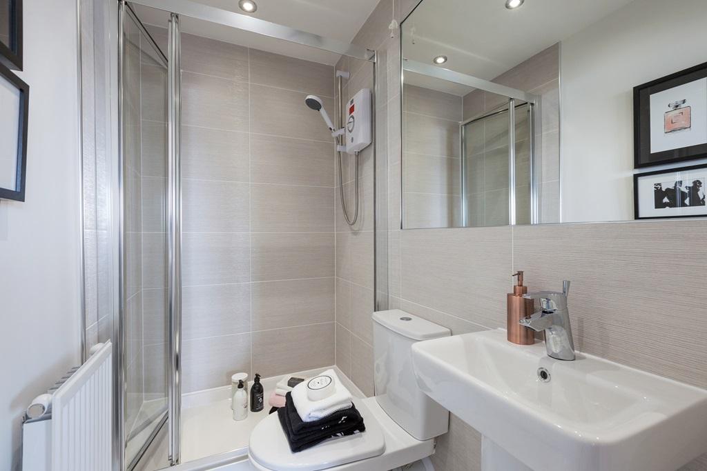 An en suite shower room to bedroom one to beat...