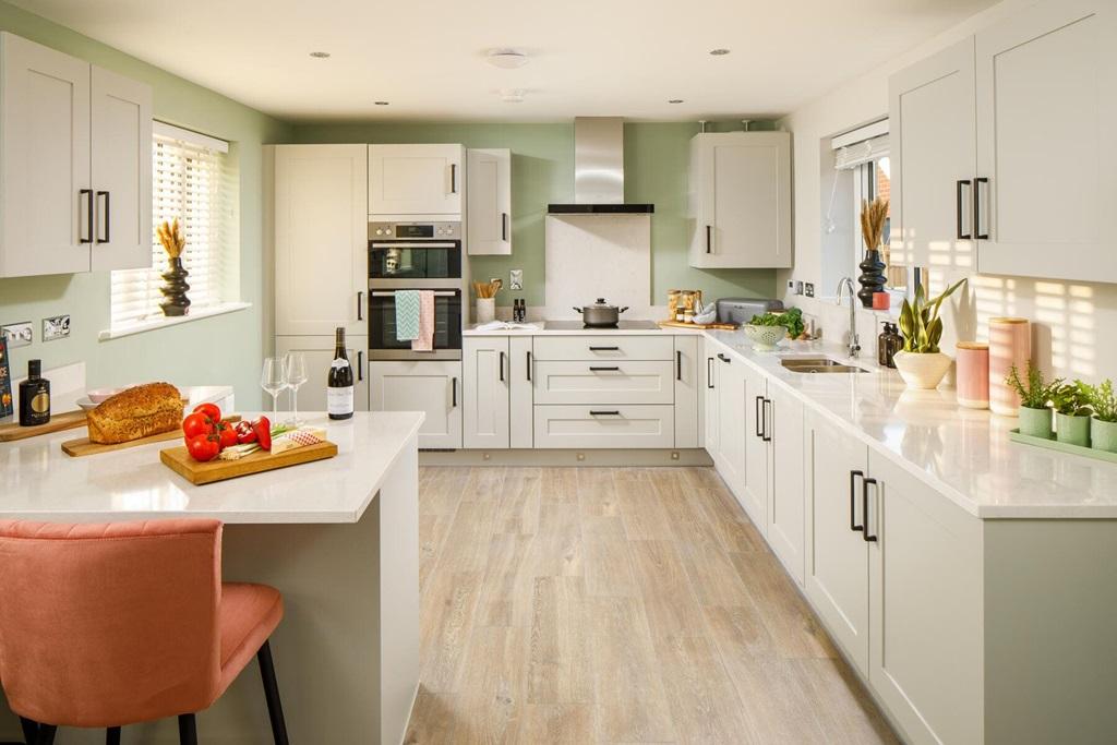 The modern kitchen has ample storage space and...