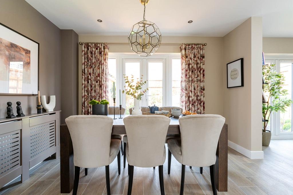 Traditional dining room with French doors to...