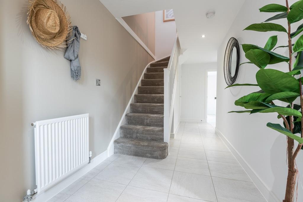 Bright and spacious hallway with under stair...