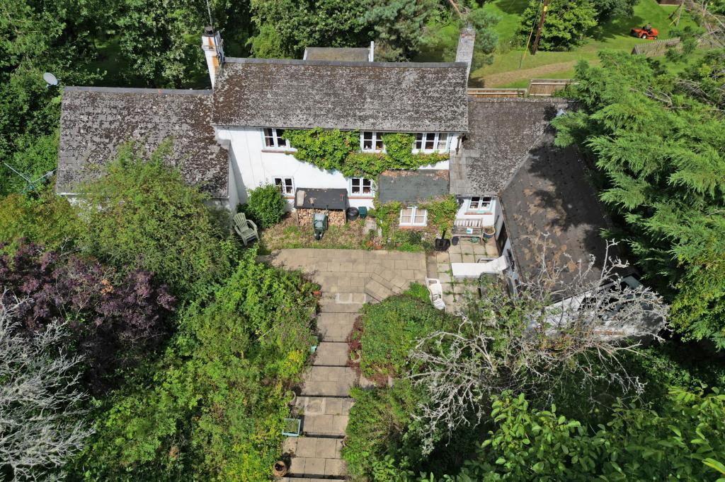 Aerial shot showing cottage and grounds