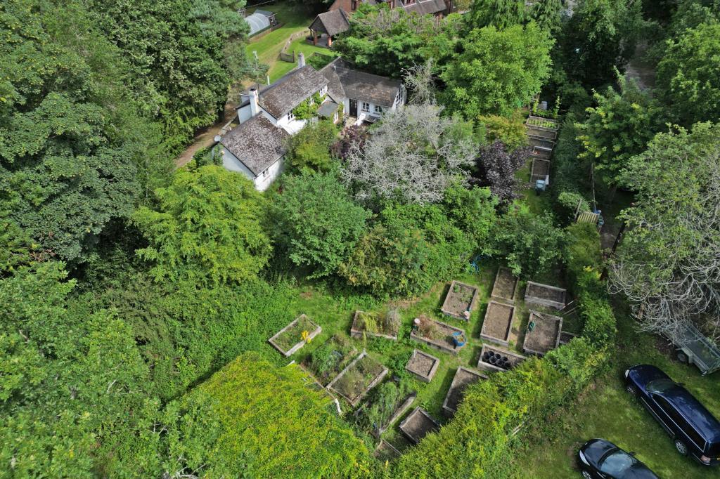 Aerial shot showing cottage and grounds