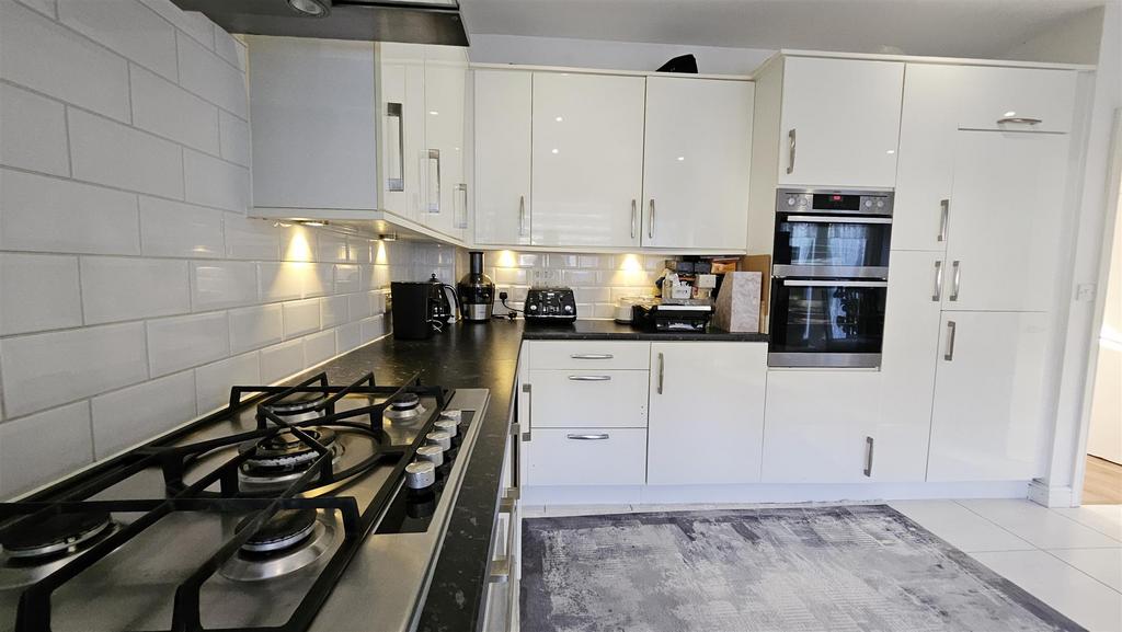 Kitchen (Rugs over tiles)
