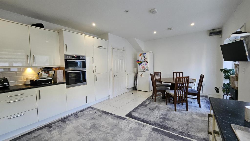 Kitchen (Rugs over tiles)