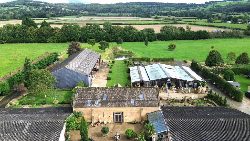 Didbrook Elevated shot over barn to buildings and