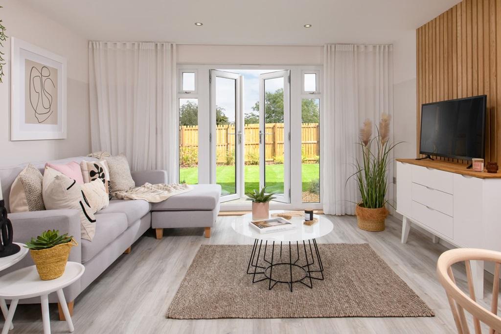 A spacious lounge with French doors to the garden