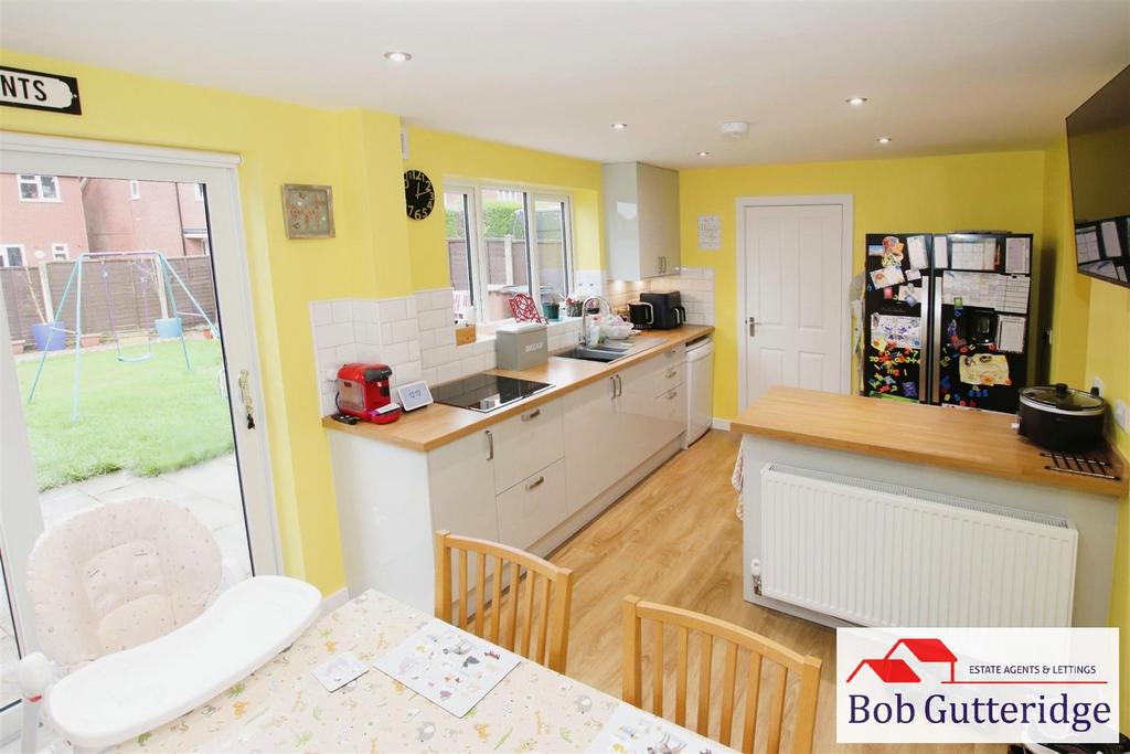 Open plan fitted kitchen / dining room