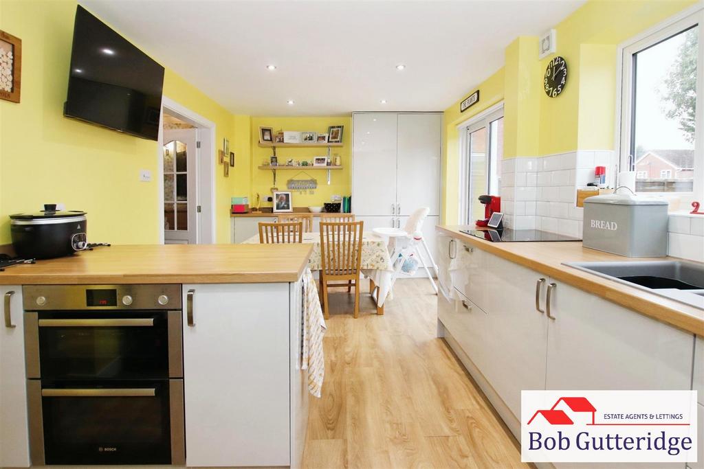 Open plan fitted kitchen / dining room