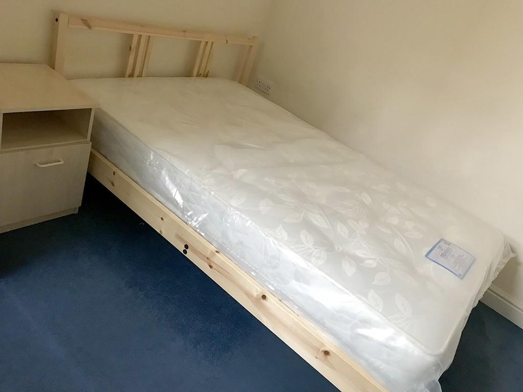 Bedroom with Bed and Mattress now opened and used