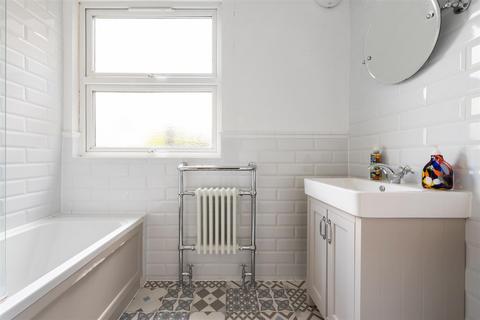 68a Quicks Road, London, SW19 1EX