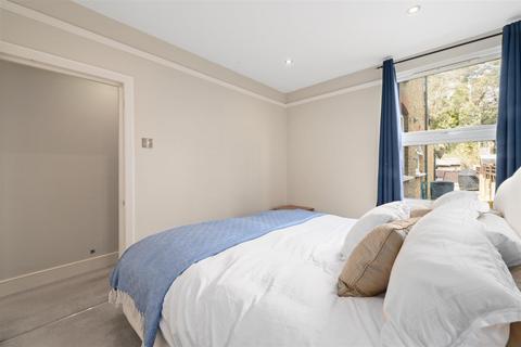68a Quicks Road, London, SW19 1EX