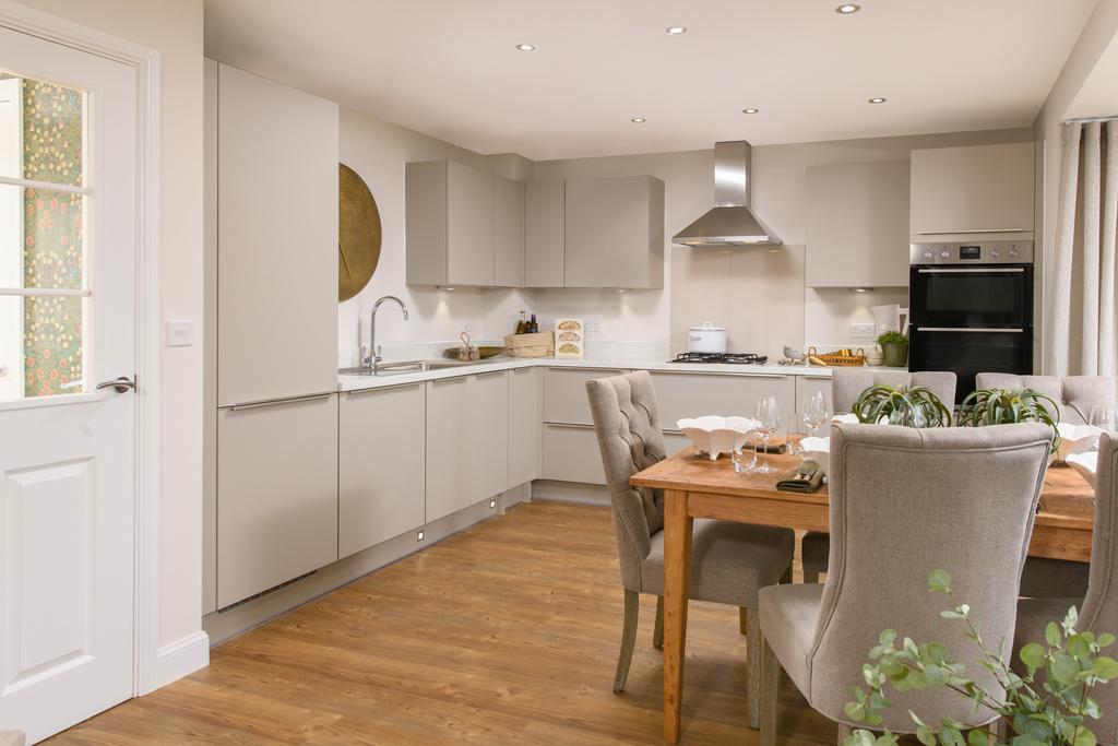 Open-plan kitchen with integrated appliances,...