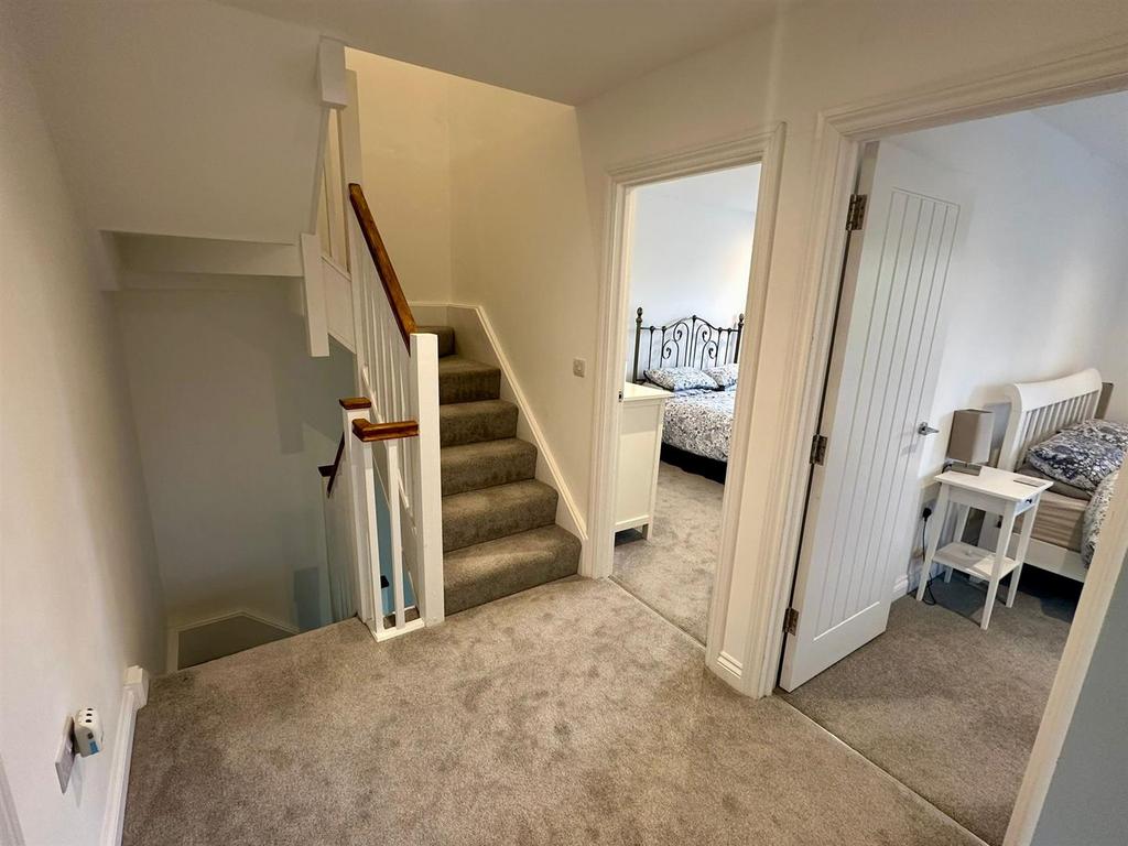 The staircase continues from the first floor to th