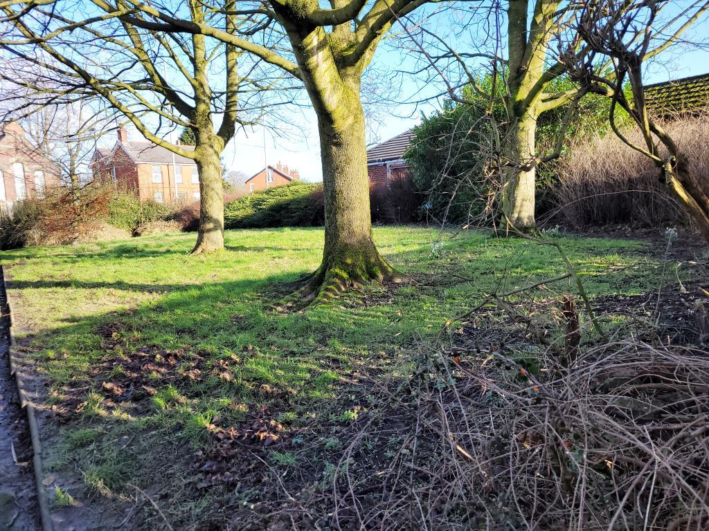 Freehold land in Preston with trees and footpath o