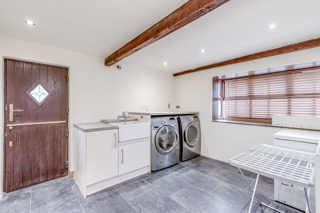 Laundry room / potential 6th bedroom