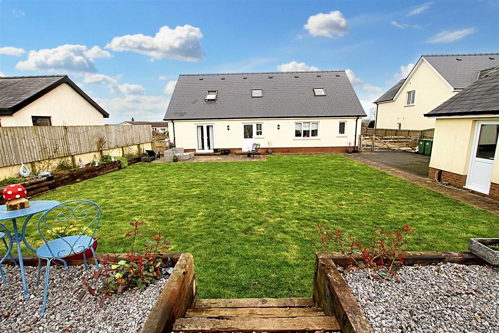 Rear garden and view of house
