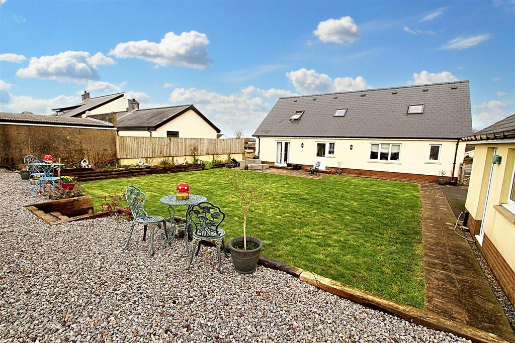 Rear garden and view of house