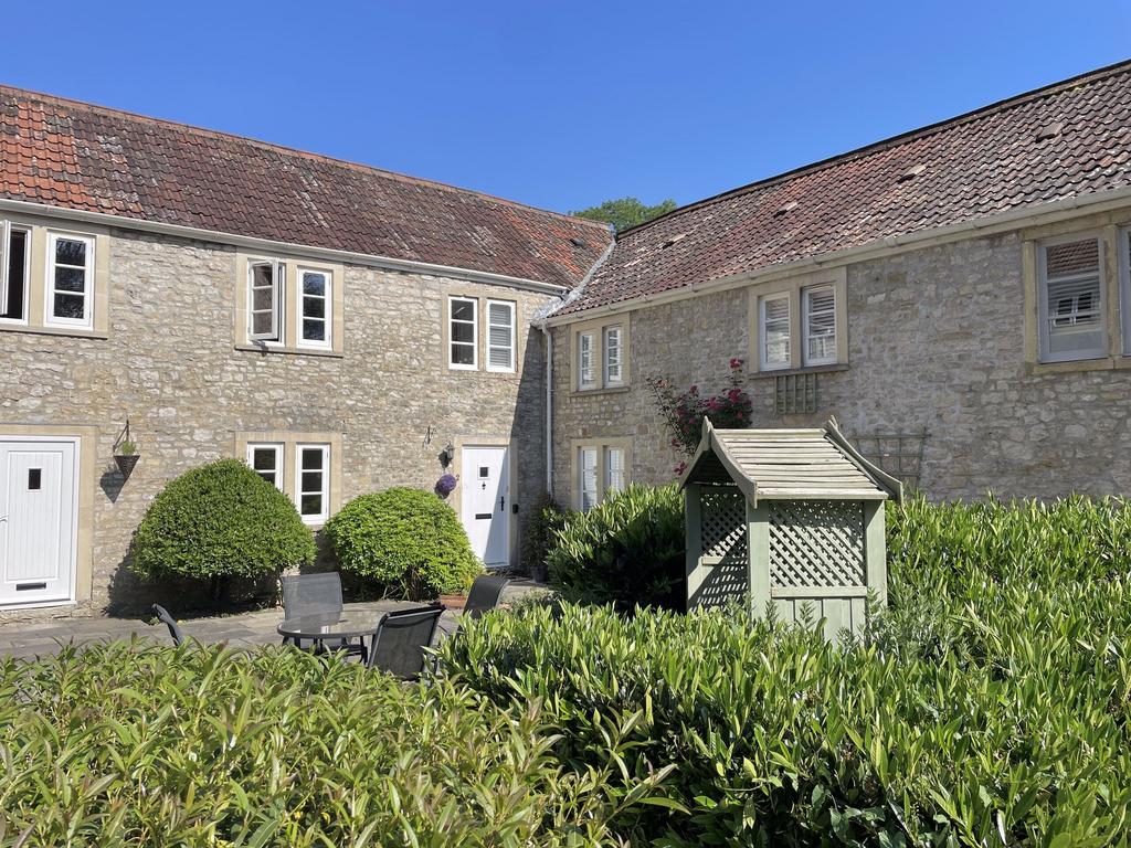 Front (Front door in the centre of the photo)