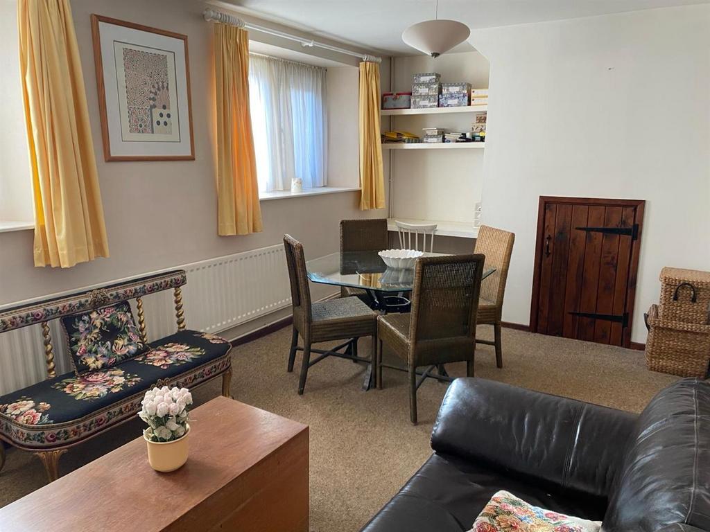 Dining Area, built in office desk, and understairs