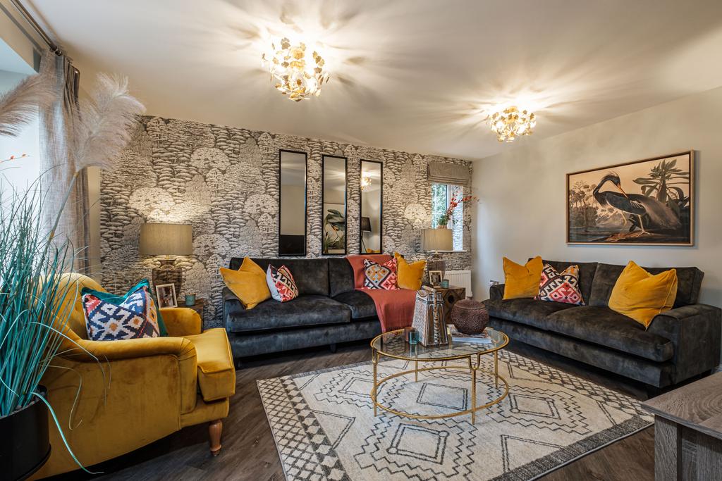 Vibrant lounge with grey and yellow sofas and...