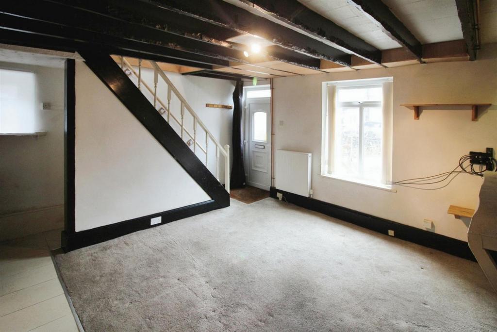 Stairs rise to the first floor