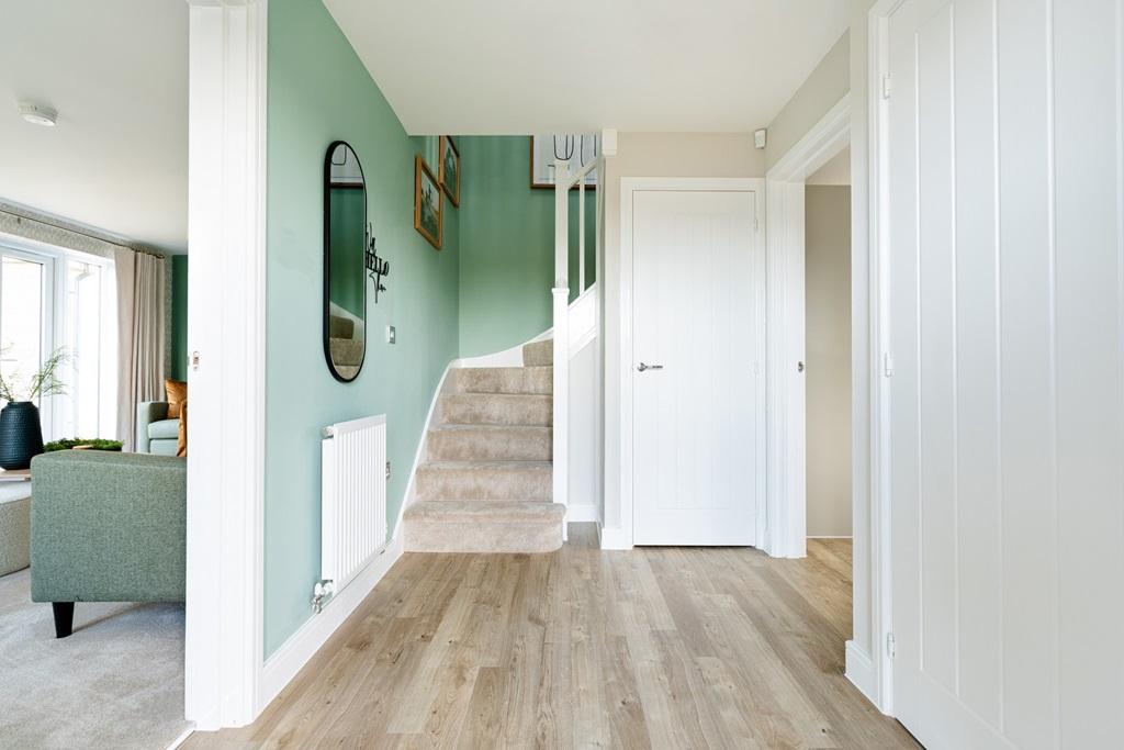 The welcoming and airy hallway space leads you...