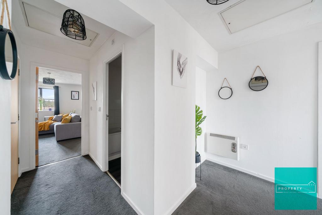 Hallway leading to Living room, main bathroom and