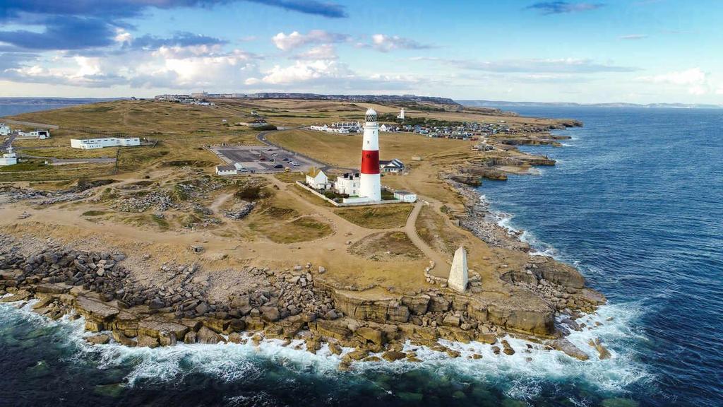 Aerial-view-of-portland-bill-lighthouse-with-waves