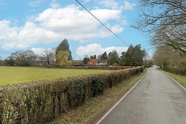 Land for sale on an affluent road.