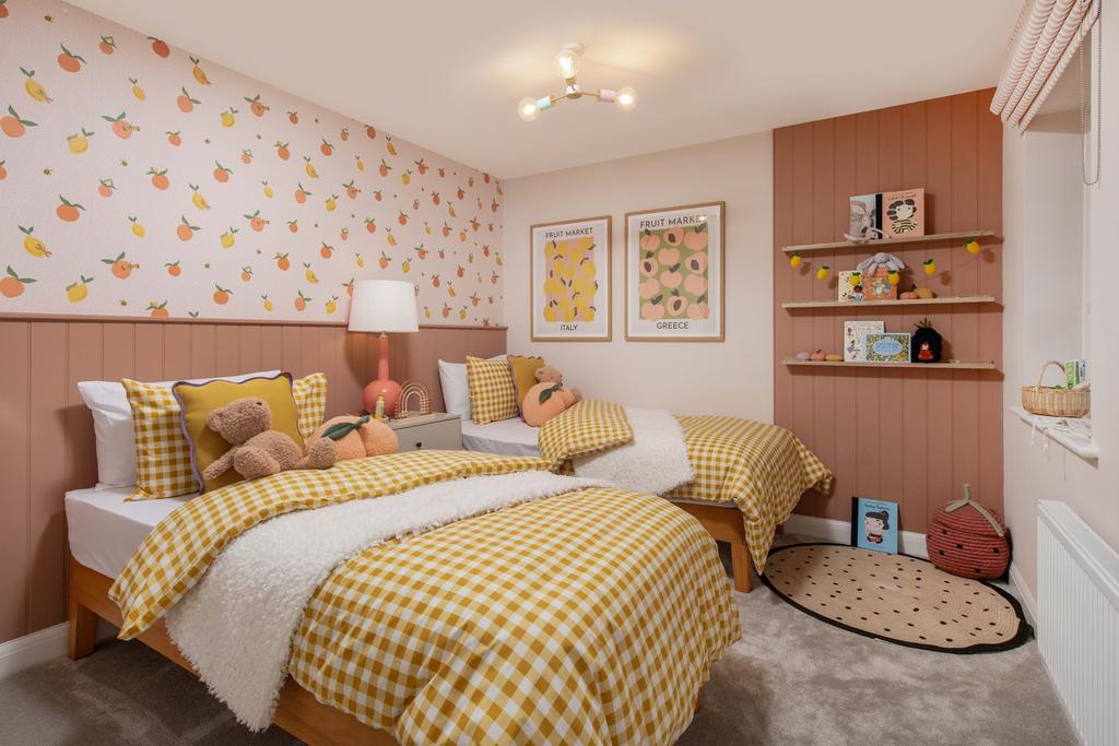 Holden bedroom with two single beds and fruit...