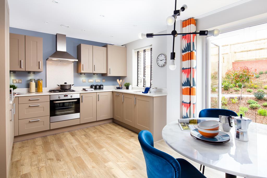 Open plan kitchen with French doors in the...