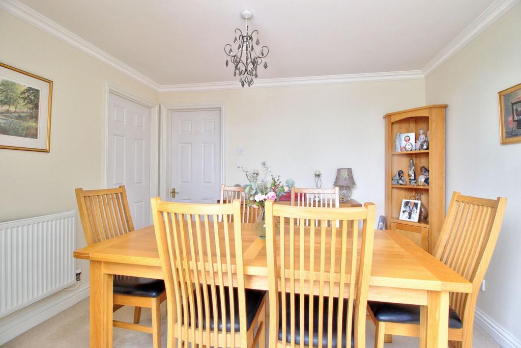 Dining room with doors to kitchen and lounge