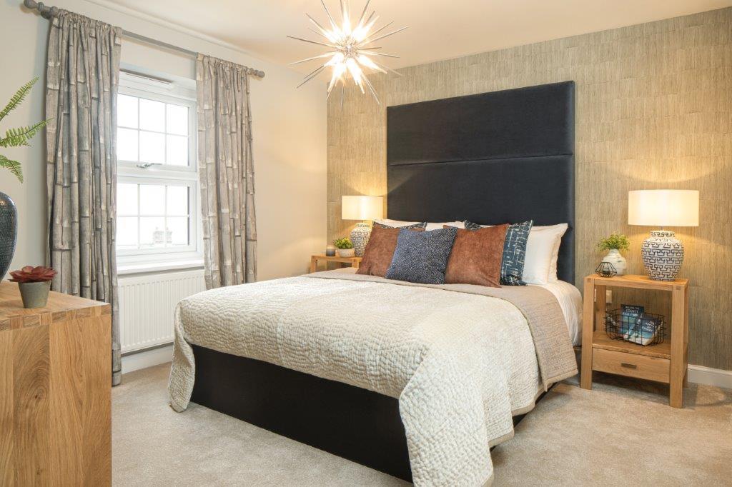 Main bedroom with oversized blue headboard