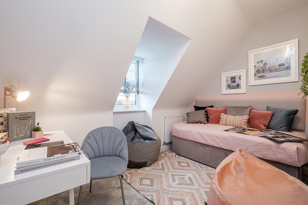 Child&#39;s pink bedroom with sofa bed