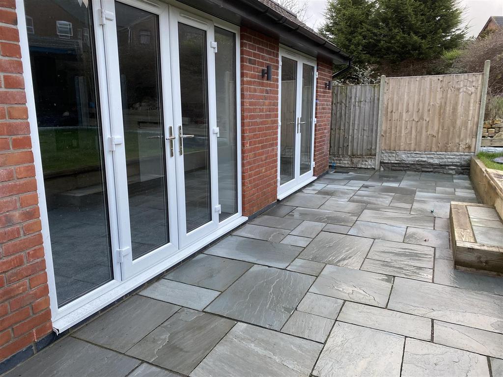 Extensive rear patio area ideal for entertaining