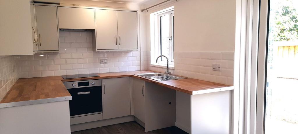 Newly fitted kitchen with electric oven, induction