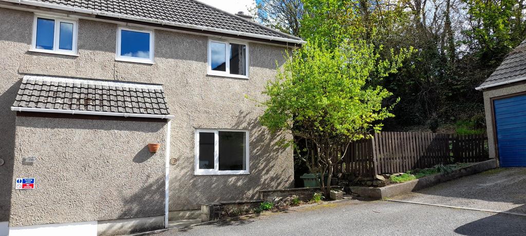 Front of property showing side entrance, off road