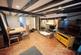 Living room with exposed beams and inglenook fire
