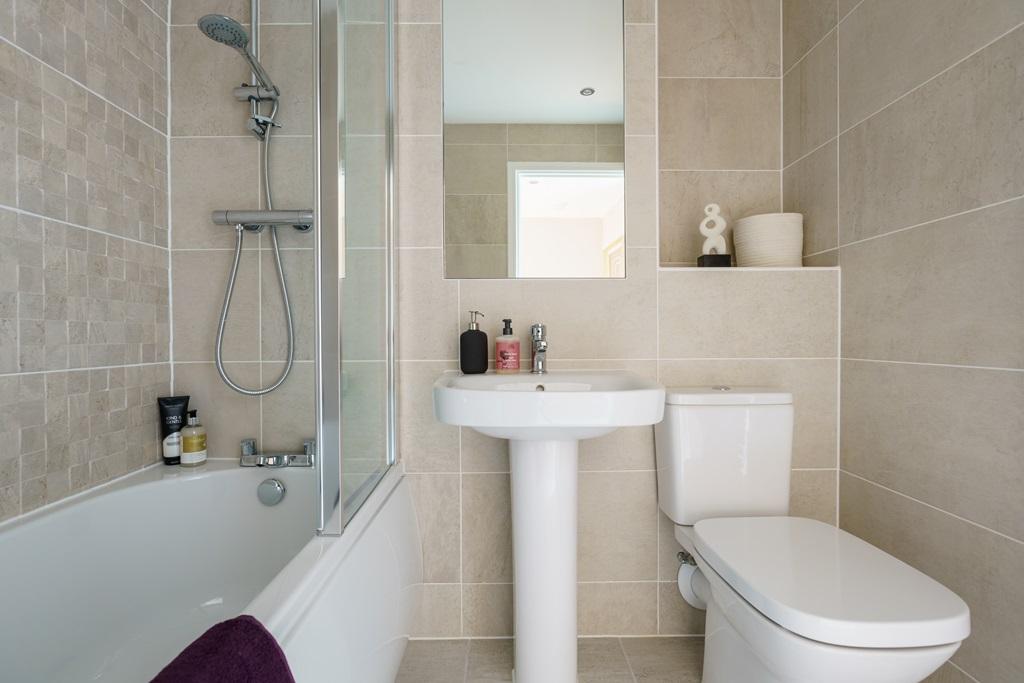 Shared family bathroom that completes the first...