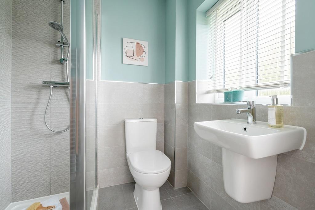 The en-suite benefits from a double shower