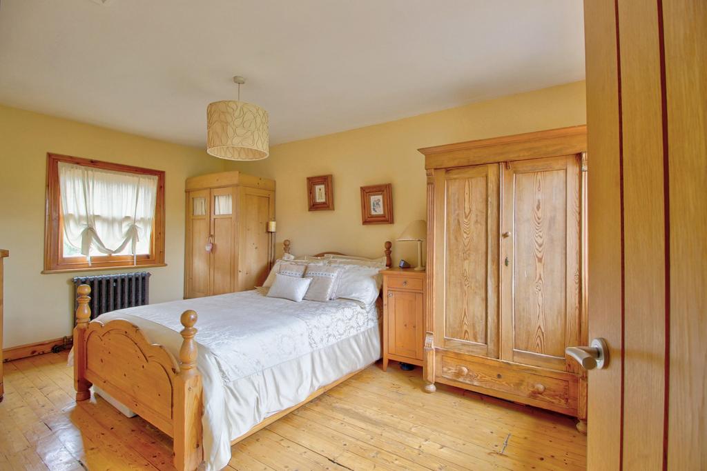 Cast iron radiator under each window