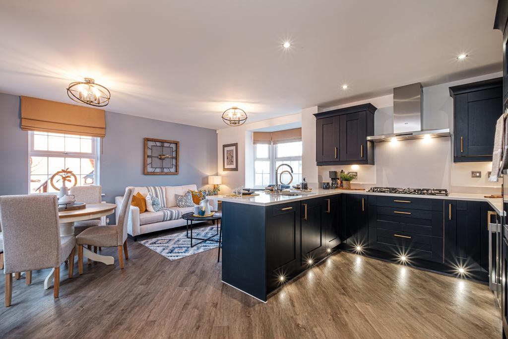 Blue themed kitchen diner with two large windows