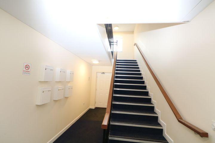 Inside communal area with post boxes ground floor